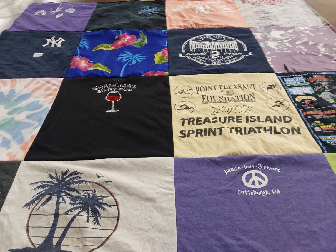 T-shirt quilt with sports, swimming themes by Jeff from NJ