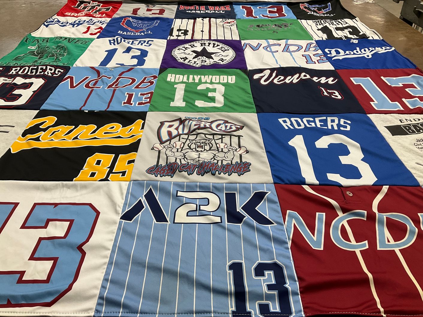 T-shirt quilt with sports themes by Sarah from NC