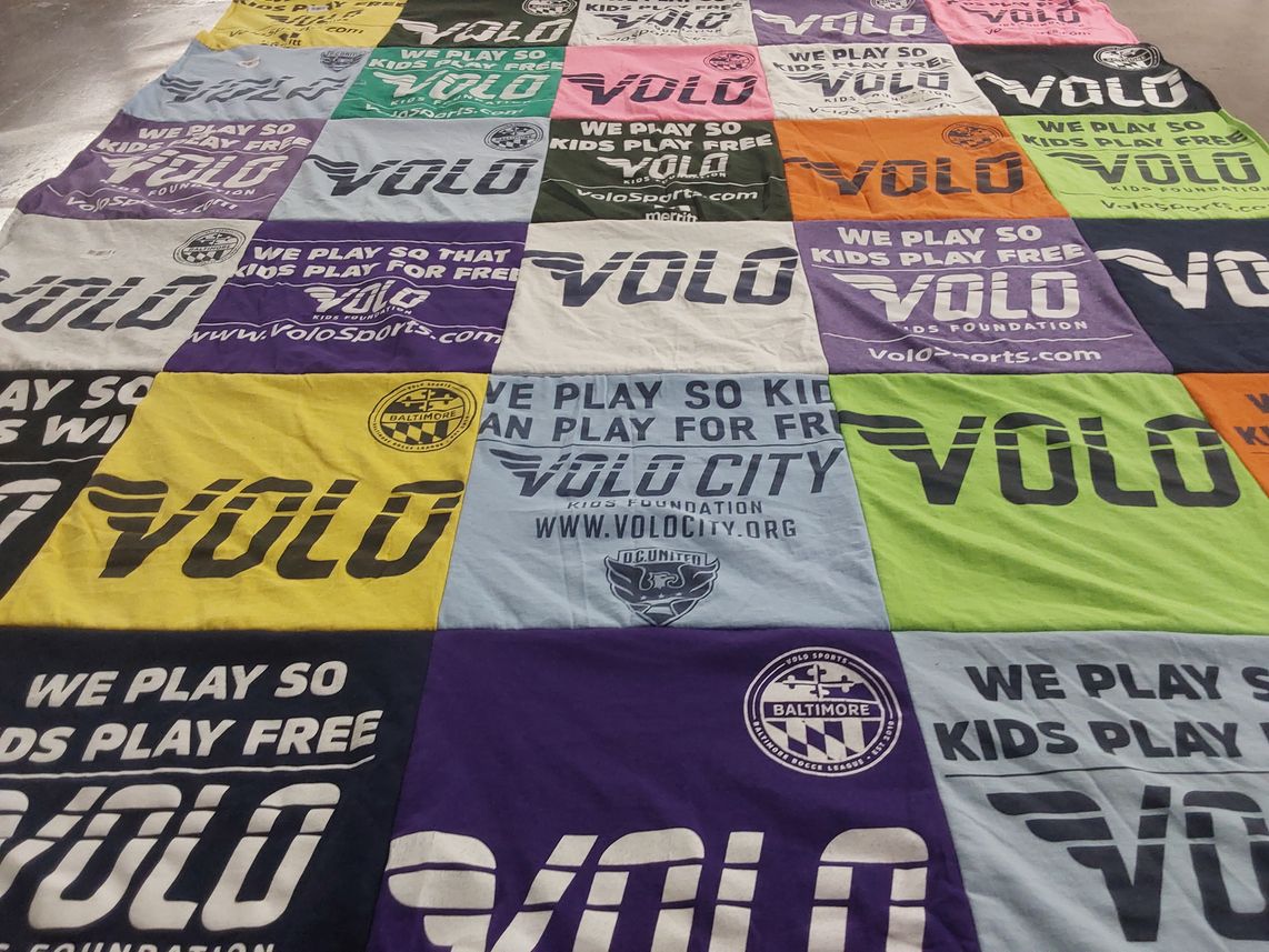 T-shirt quilt with sports, youth programs themes by Cate from MD