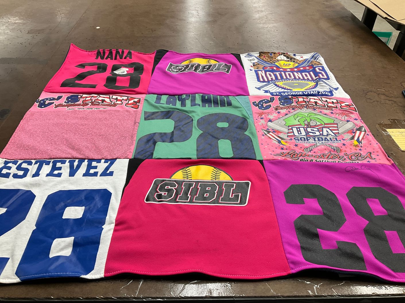 T-shirt quilt with softball, sports themes by Rosaura from CA