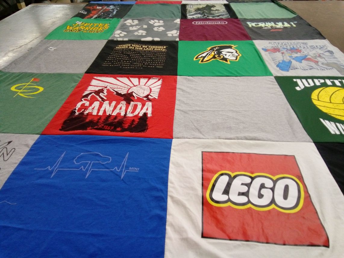 T-shirt quilt with gaming, travel themes by April from FL