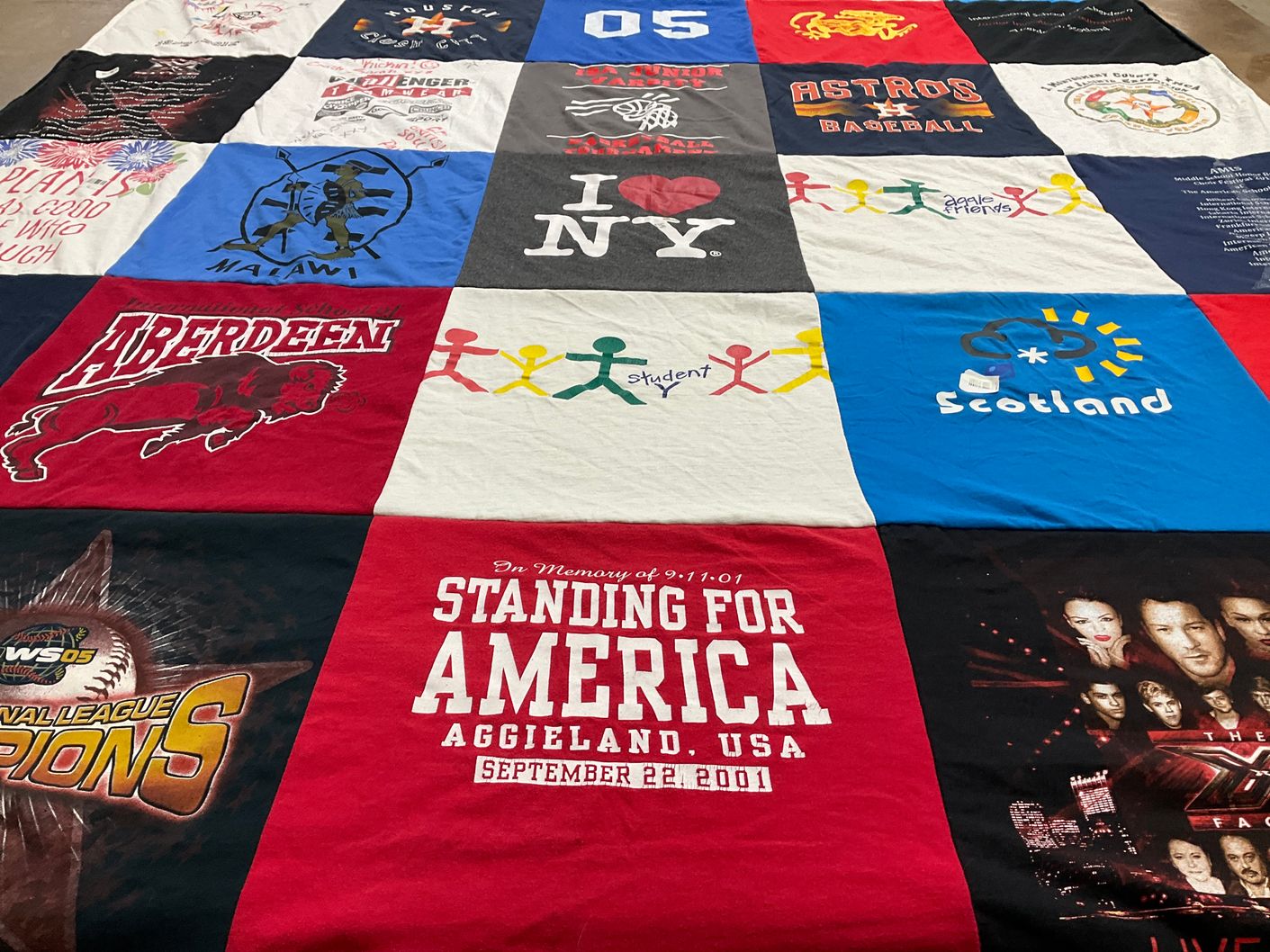 T-shirt quilt with sports, travel themes by Lisa from TX
