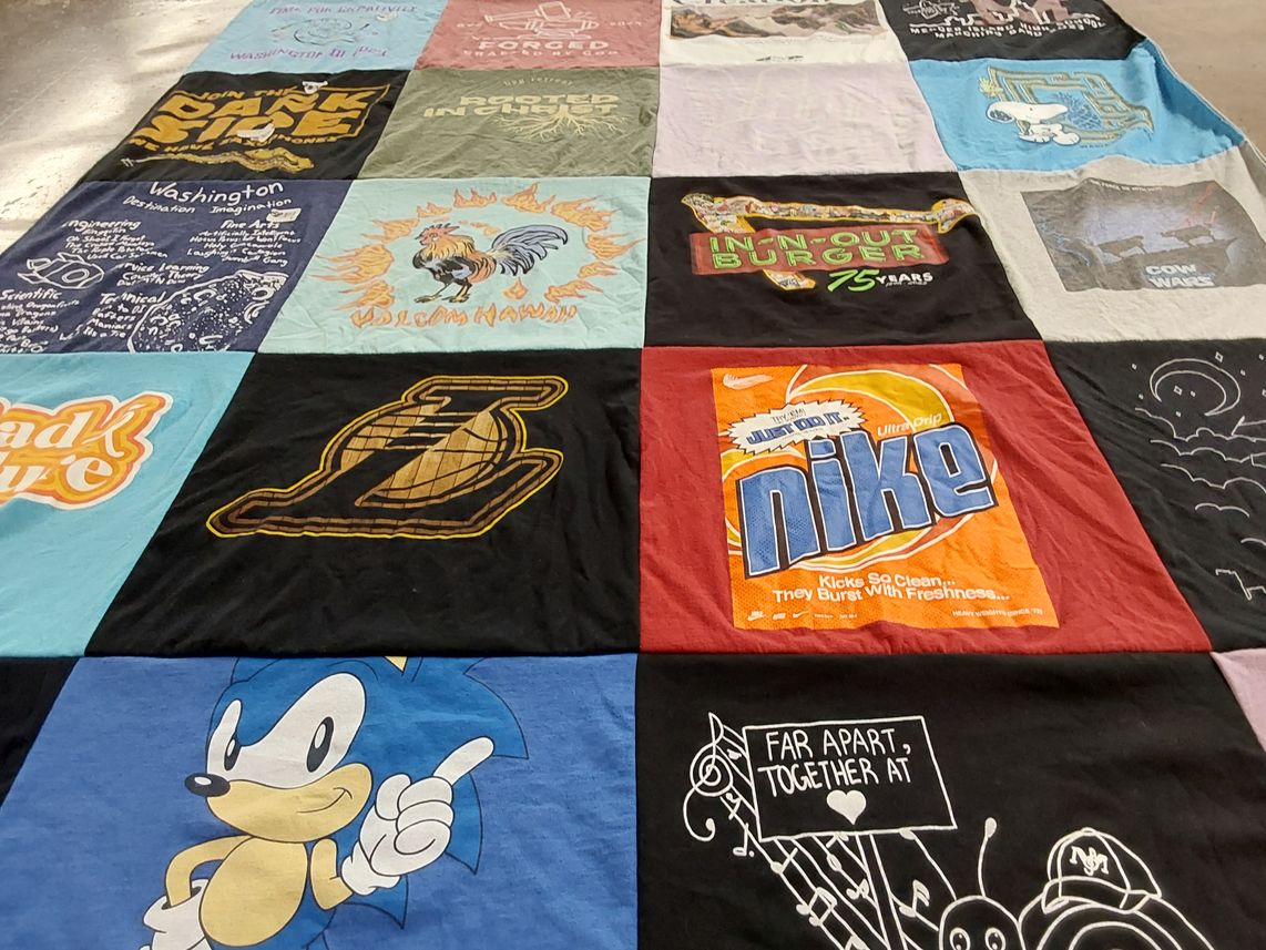 T-shirt quilt with food, music themes by Grace from WA