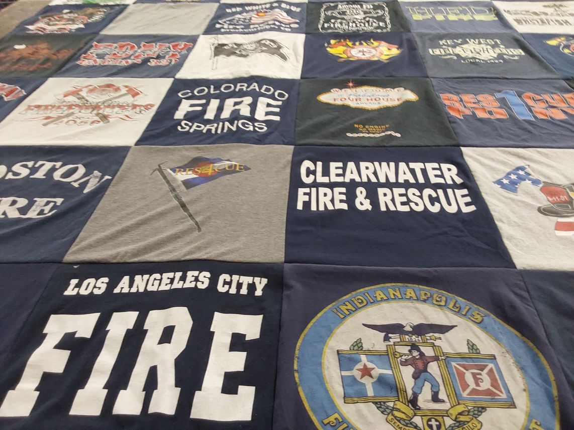 T-shirt quilt with firefighting, emergency services themes by Felicia from CO