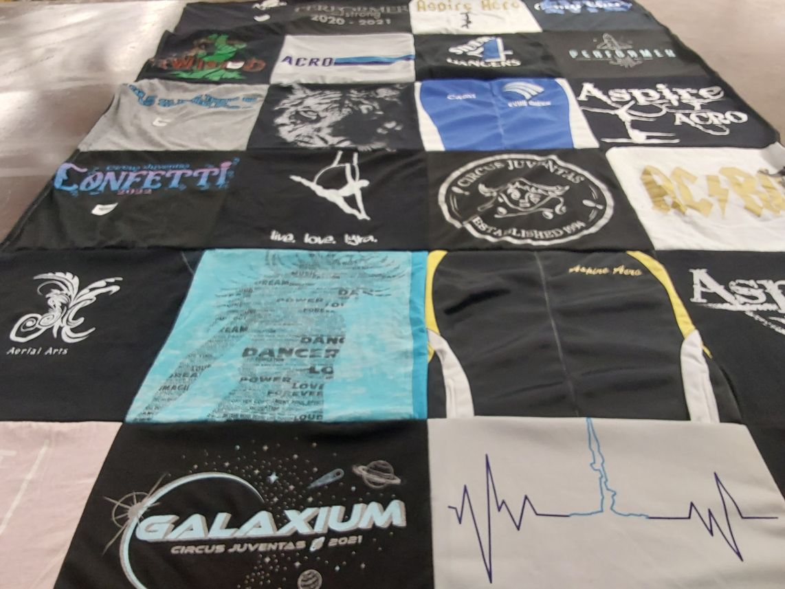 T-shirt quilt with circus, aerial arts themes by Jessica from MN