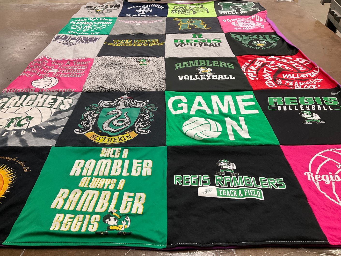 T-shirt quilt featuring regis ramblers track & field, regis ramblers volleyball by megan from WI