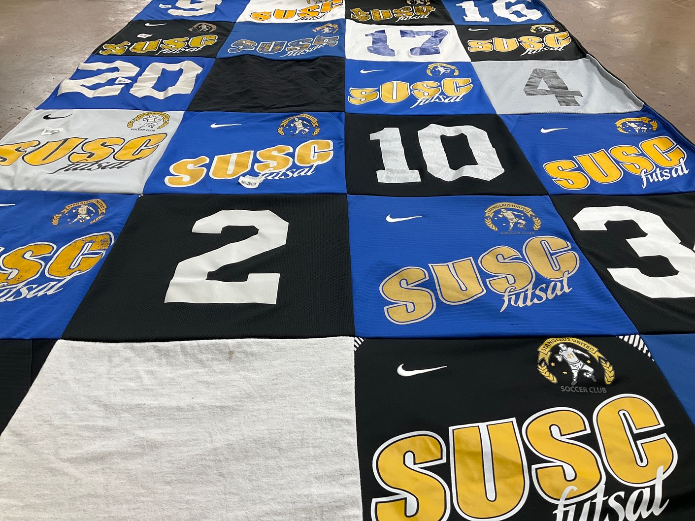 T-shirt quilt with soccer, futsal themes by Holly from CA