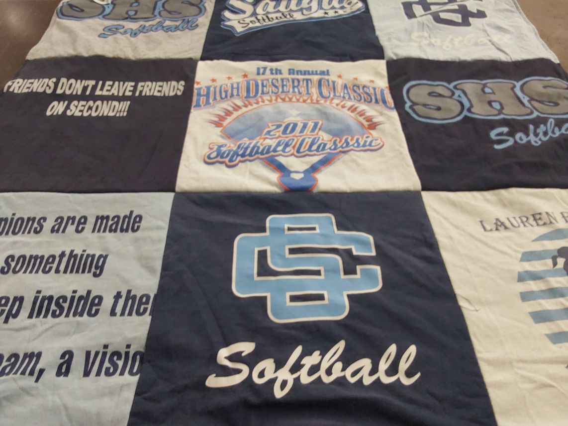 T-shirt quilt featuring some high school softball team by Sara from SC