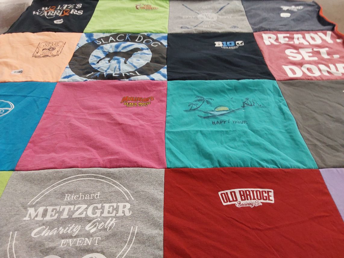 T-shirt quilt with beach, sports themes by Teresa from FL