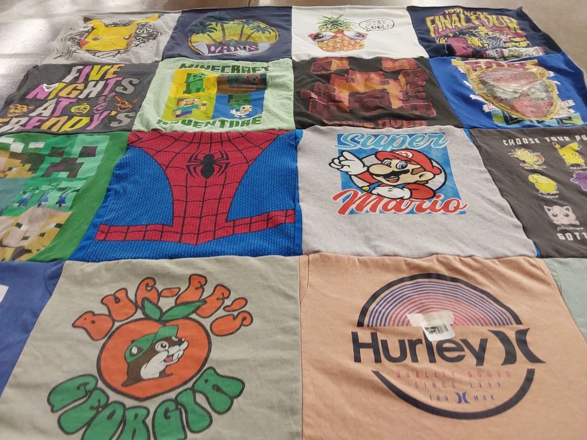 T-shirt quilt with video games, comics themes by Darcy from FL