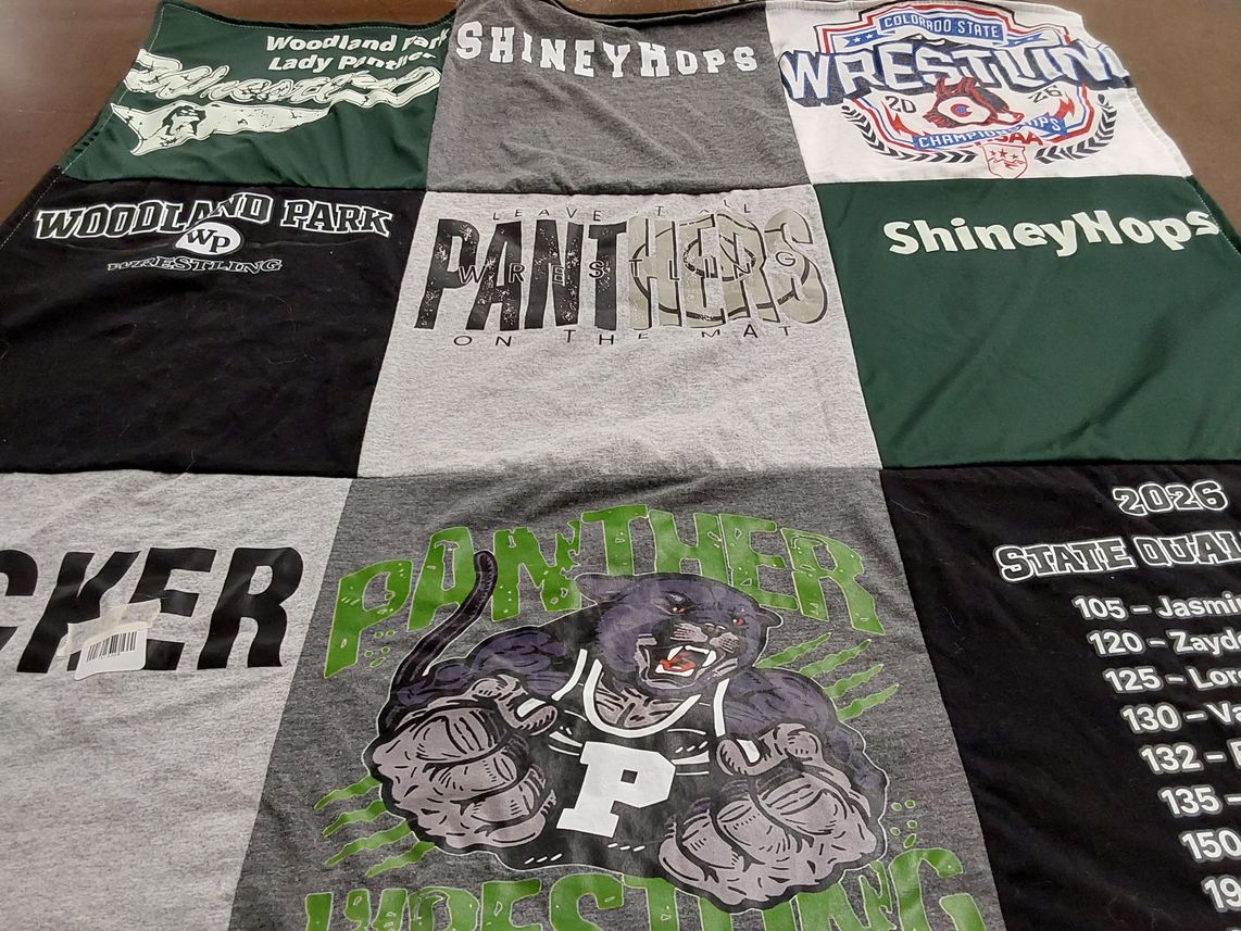 T-shirt quilt featuring woodland park wrestling by Christy from CO