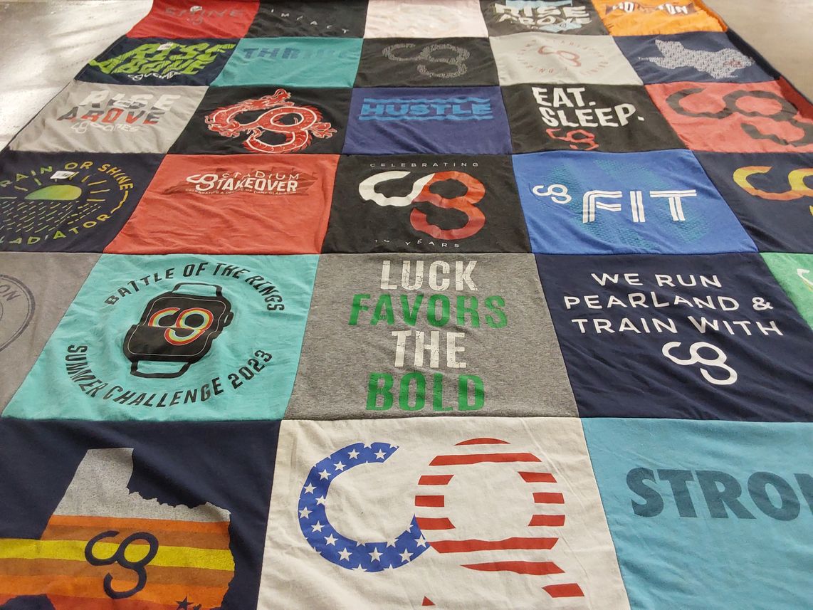 T-shirt quilt with fitness, sports themes by Tia from TX