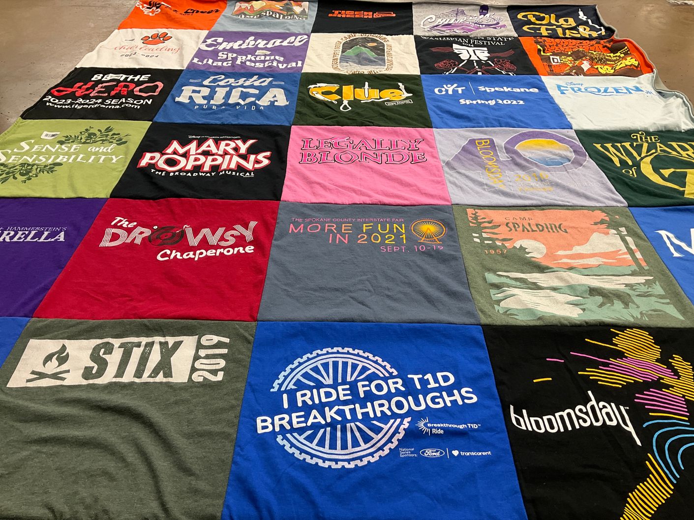 T-shirt quilt with theater, music themes by Julie from WA