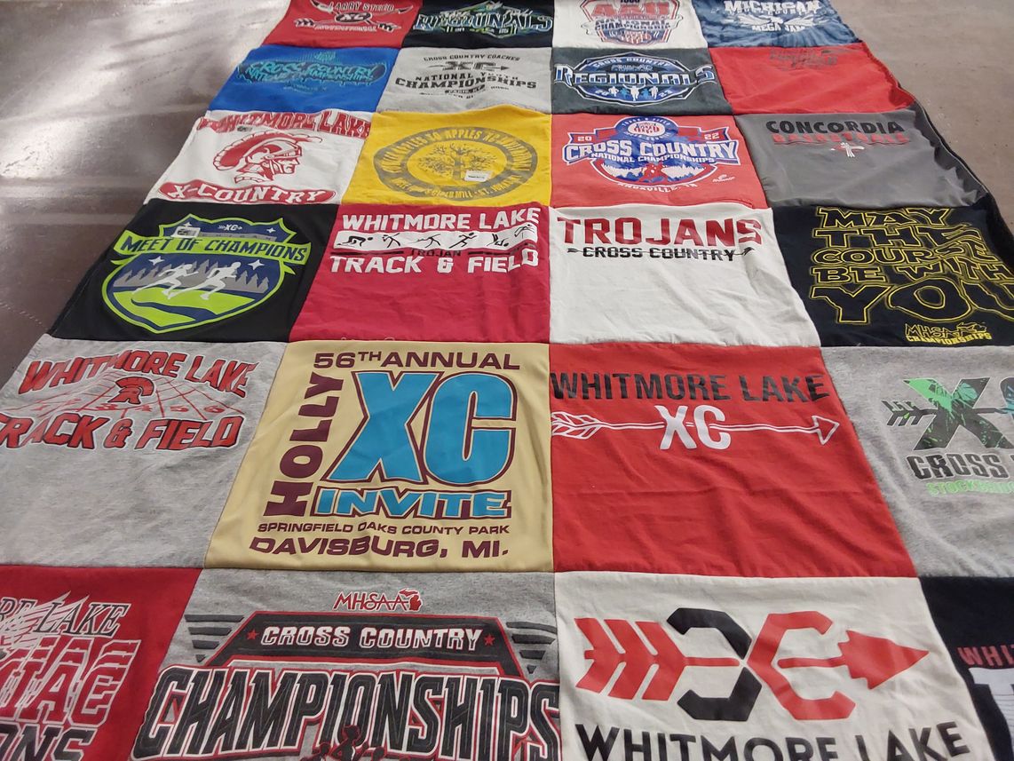 T-shirt quilt featuring whitmore lake trojans, whitmore lake cross country by Casey from MI