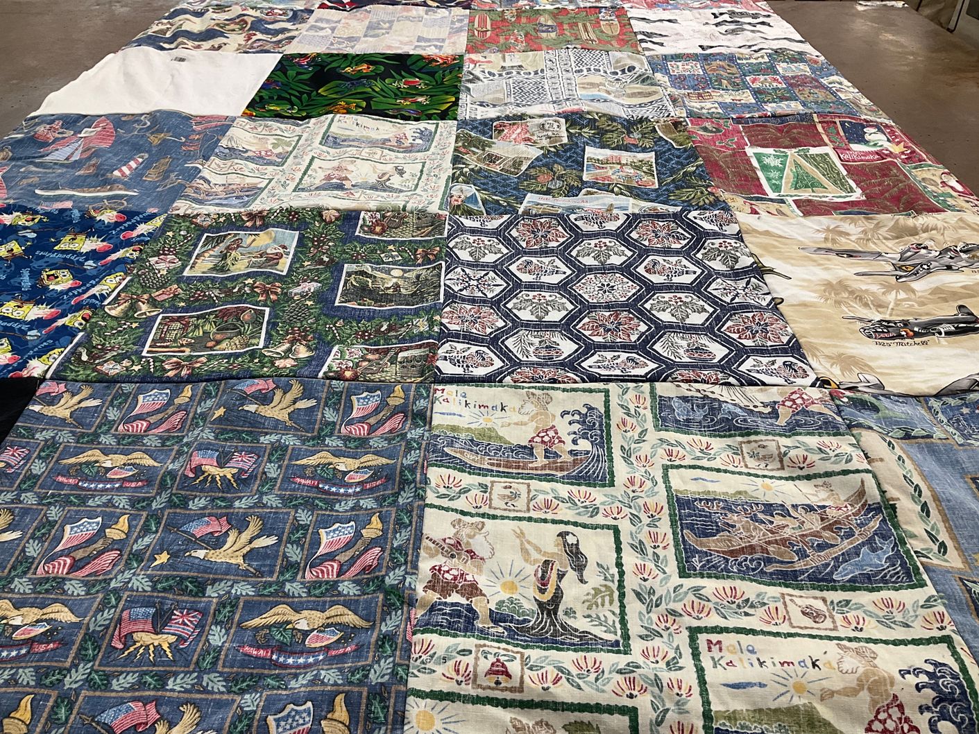 T-shirt quilt with quilting, sewing themes by Erin from CA