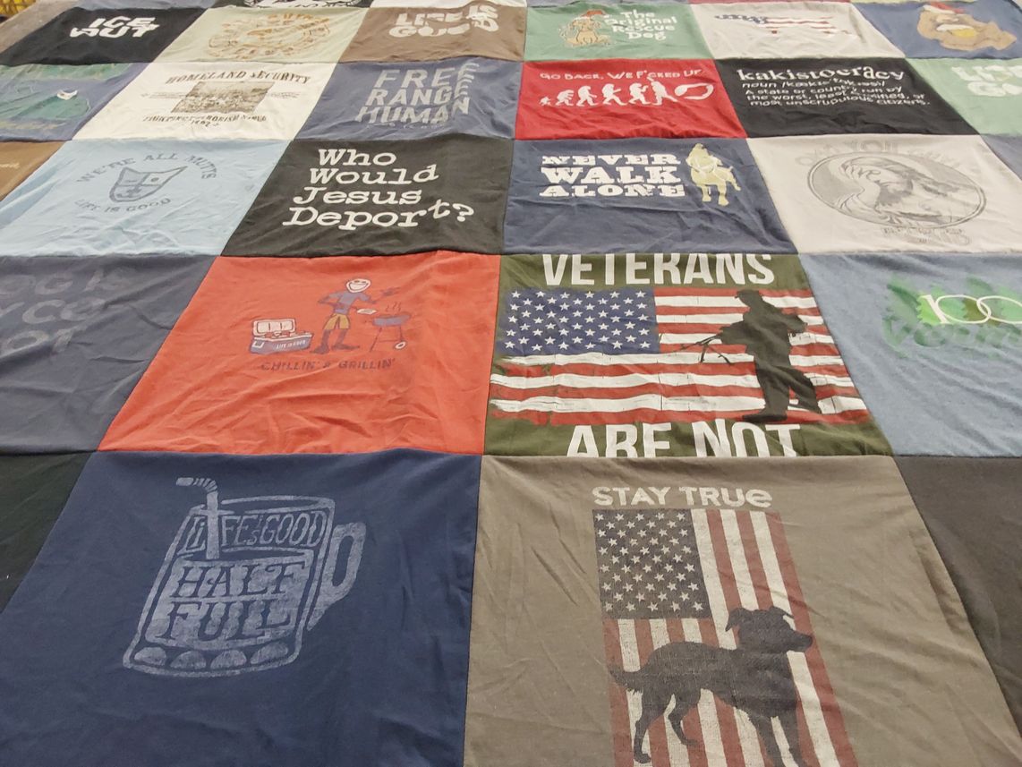 T-shirt quilt with human rights, veteran support themes by Melissa from AZ