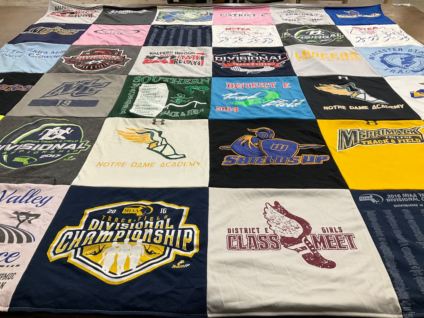 T-shirt quilt featuring southern track and field, merrimack college track and field by Bridget from MA