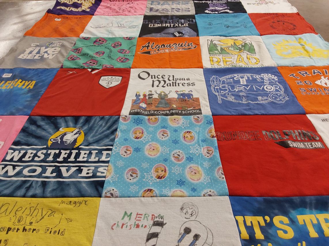 T-shirt quilt featuring dundee dolphins swim team, westfield wolves by Susan from IL