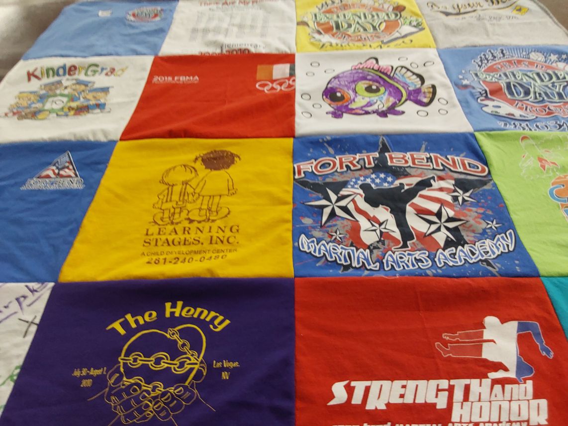 T-shirt quilt with martial arts, education themes by Kareisha from TX