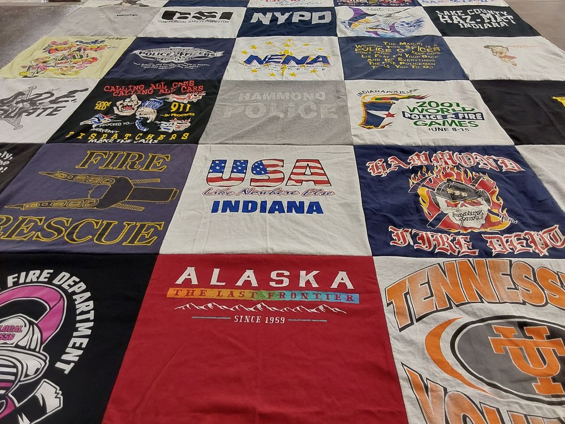 T-shirt quilt with firefighting, policing themes by Chris from IN