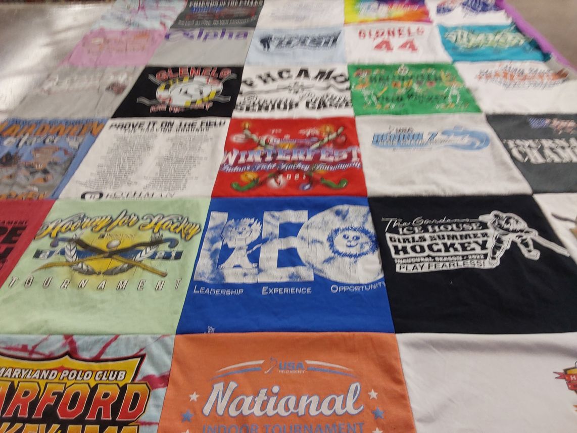 T-shirt quilt with sports, hockey themes by Starlynn from MD