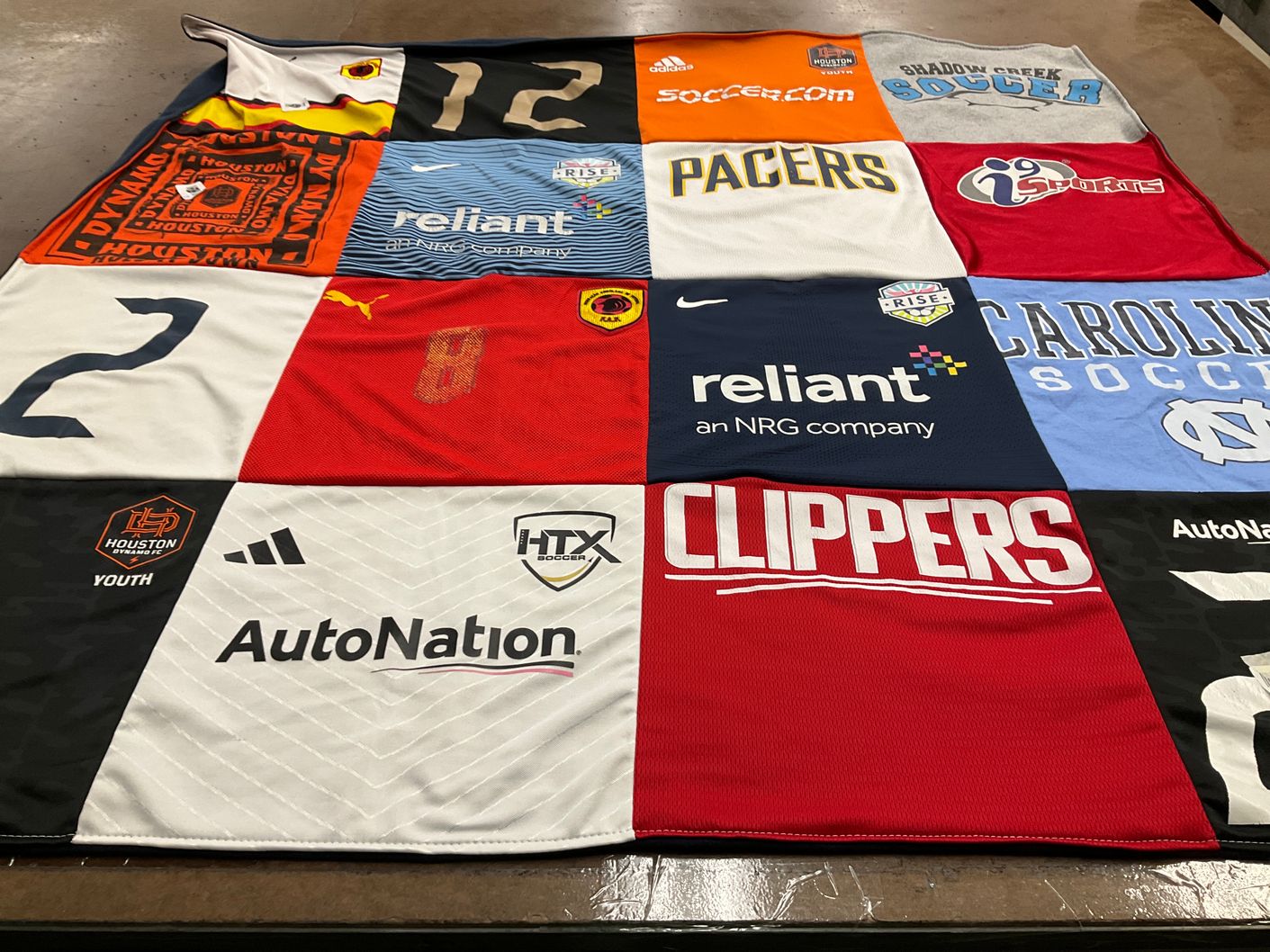 T-shirt quilt featuring houston dynamo by Mary Kate from TX