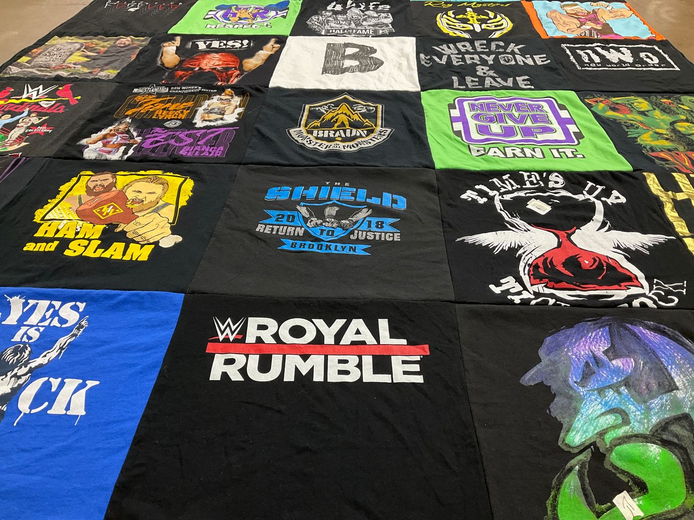 T-shirt quilt with wrestling themes by Heather from MO