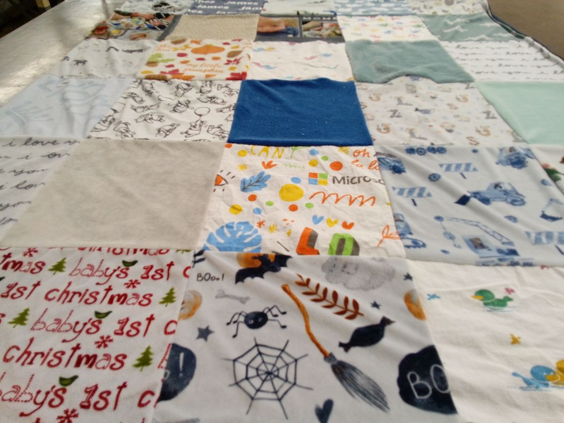 T-shirt quilt with baby milestones, seasonal celebrations themes by Kathryn from VA