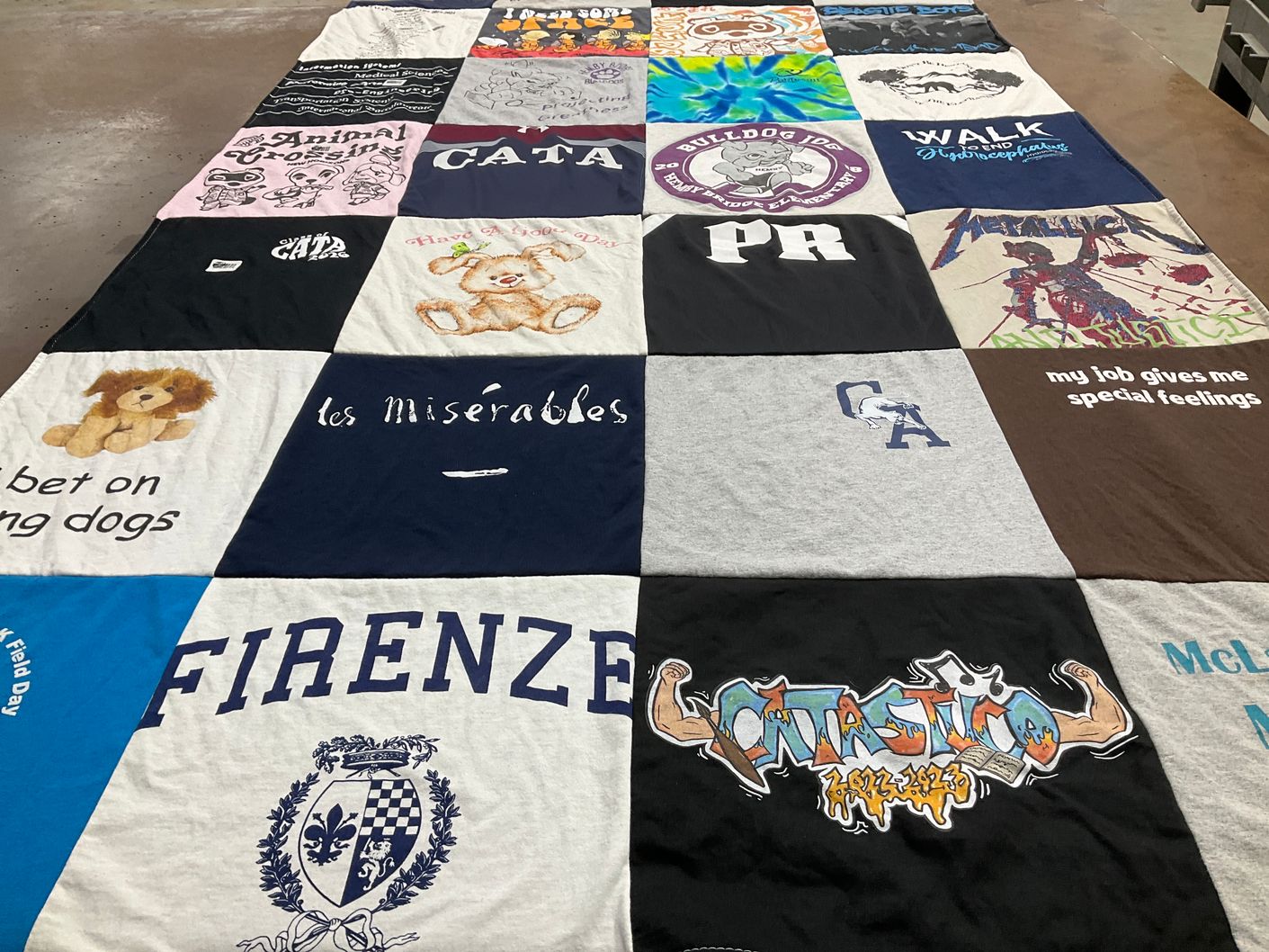 T-shirt quilt with theater, animals themes by Laura from NC