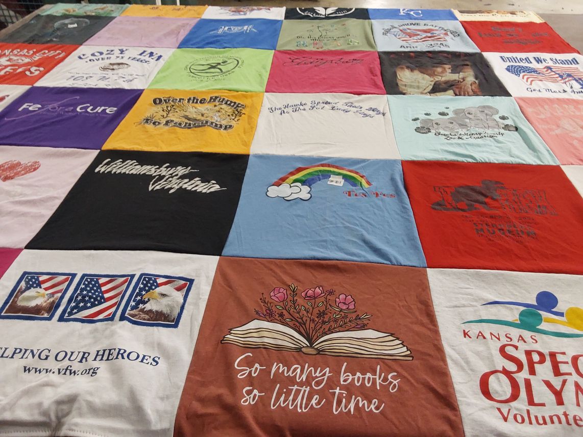 T-shirt quilt with reading, volunteering themes by Deborah from KS