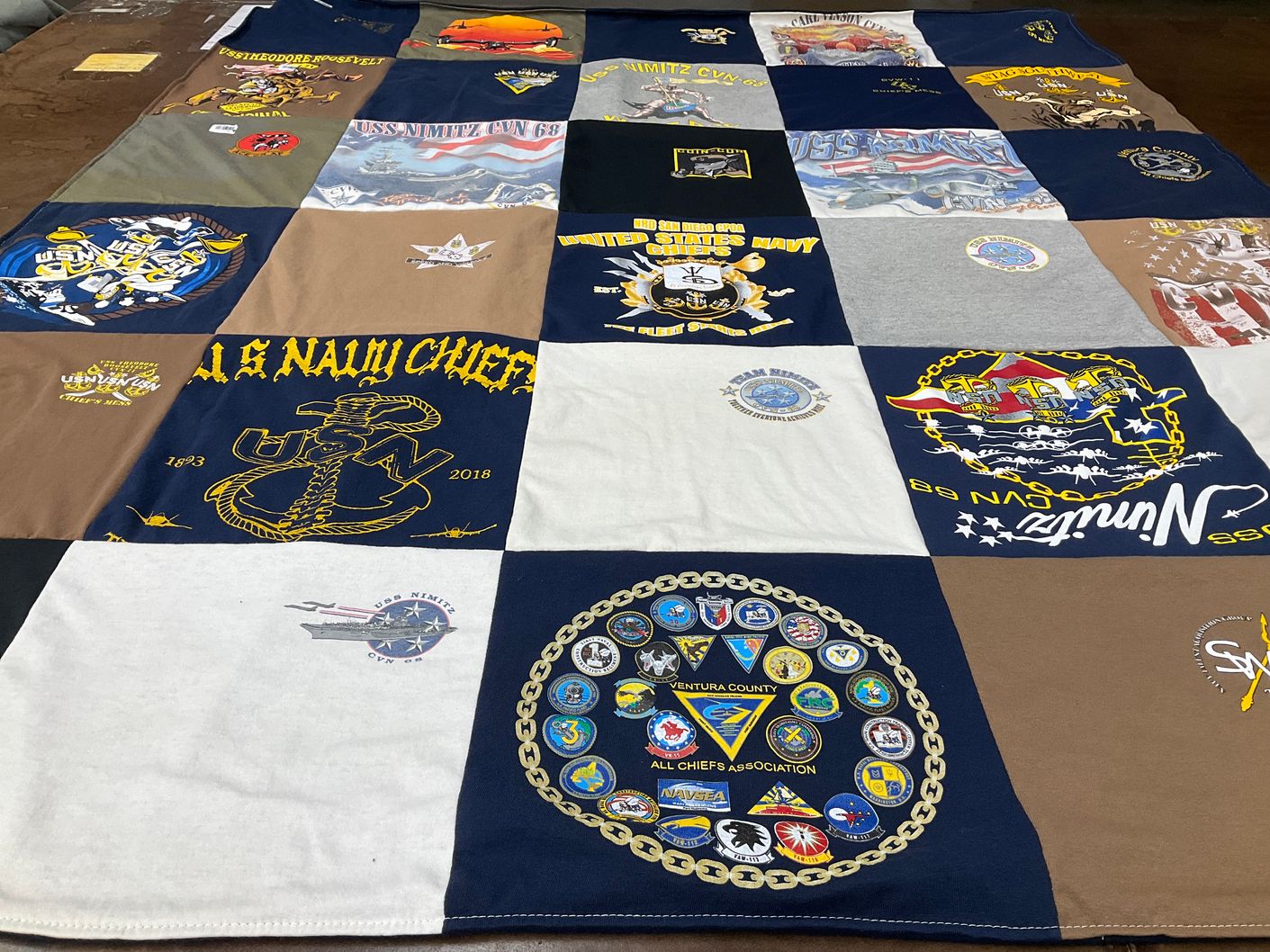 T-shirt quilt with military, navy themes by Nobel from CA