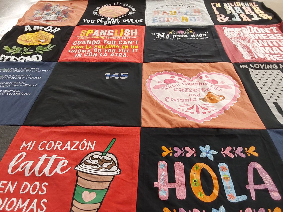 T-shirt quilt with bilingualism, language themes by Olga from IA