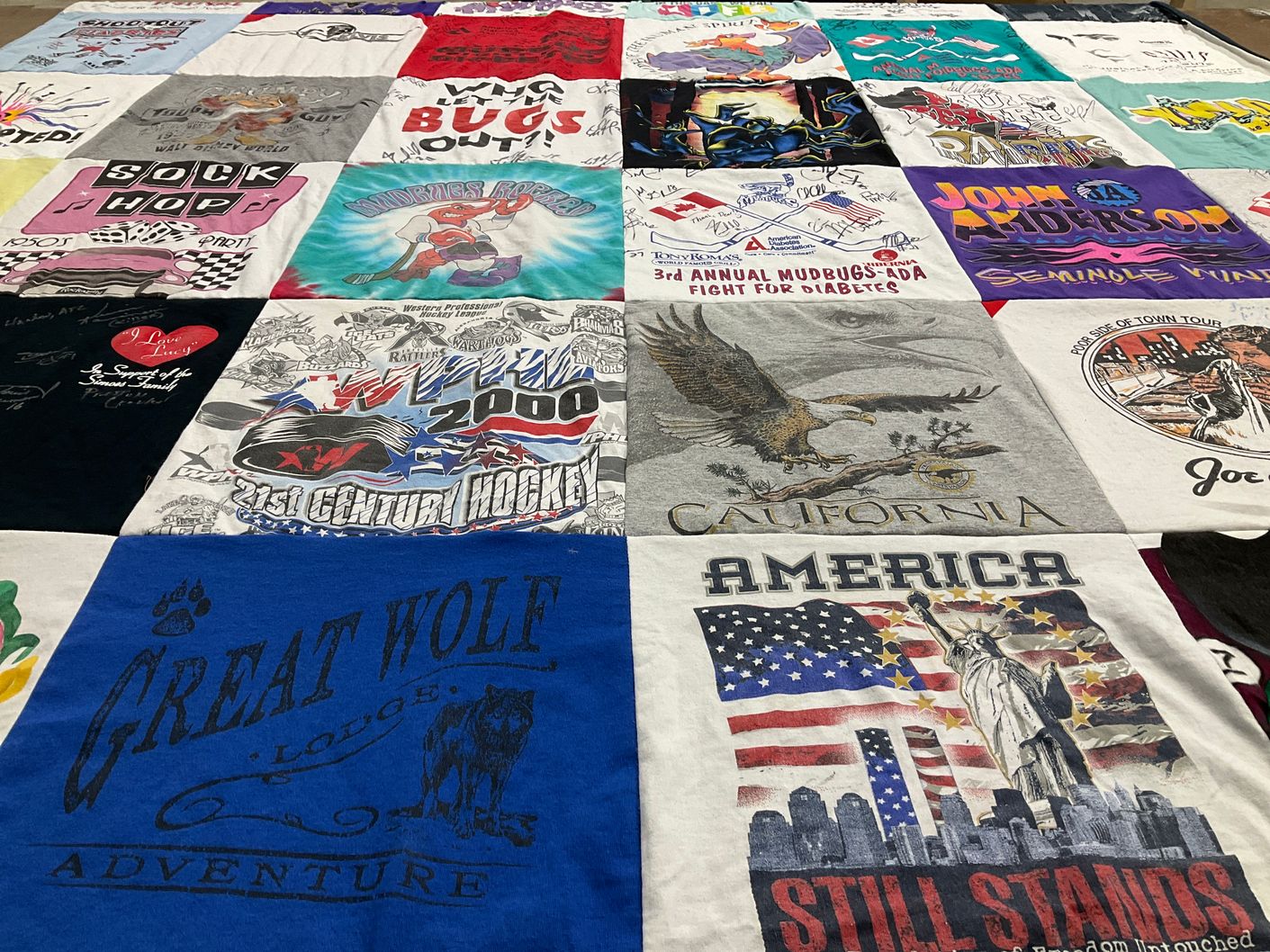 T-shirt quilt with adventure, sports themes by CAROL from LA