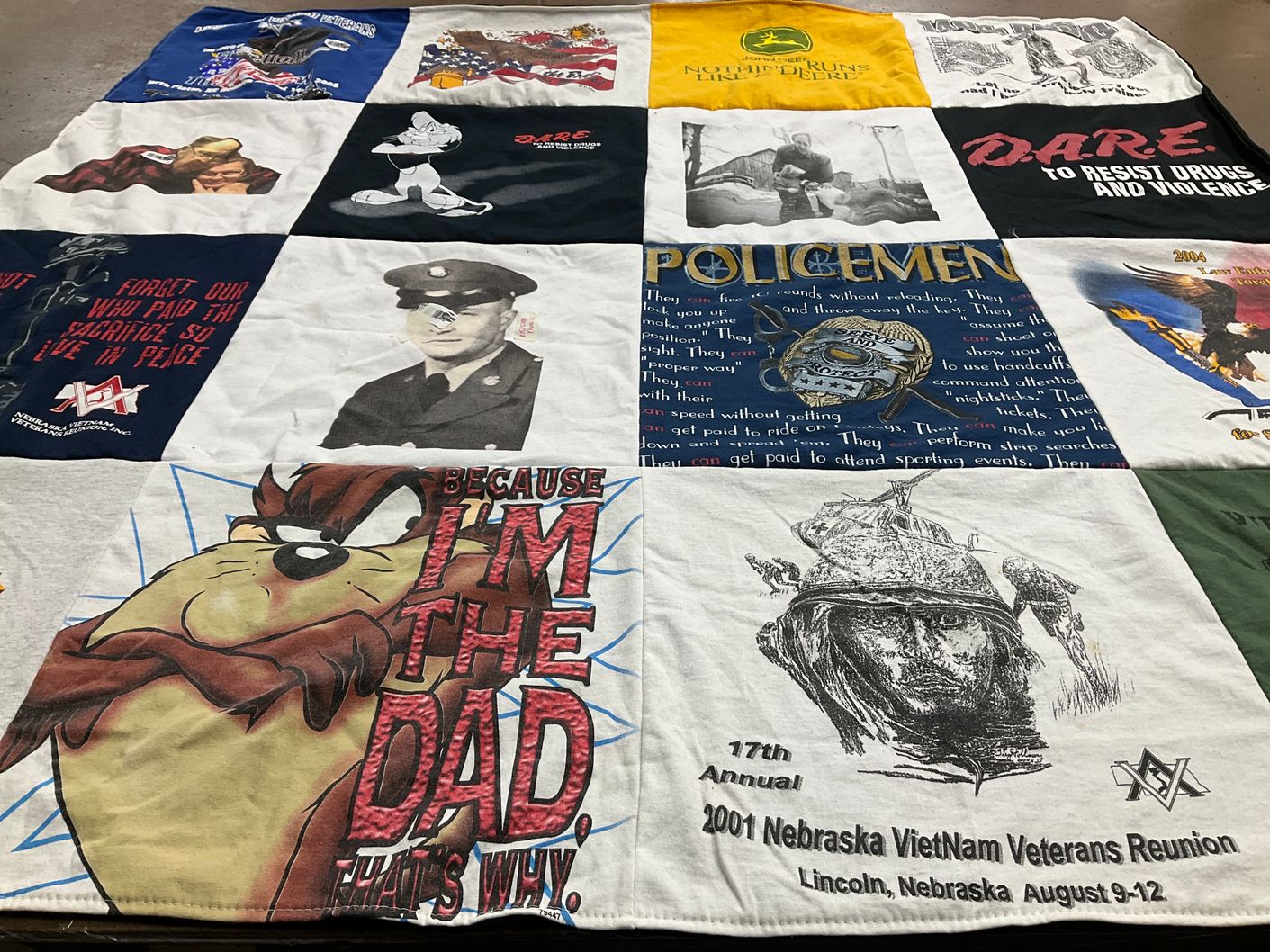 T-shirt quilt with law enforcement, veterans themes by Donna from NE