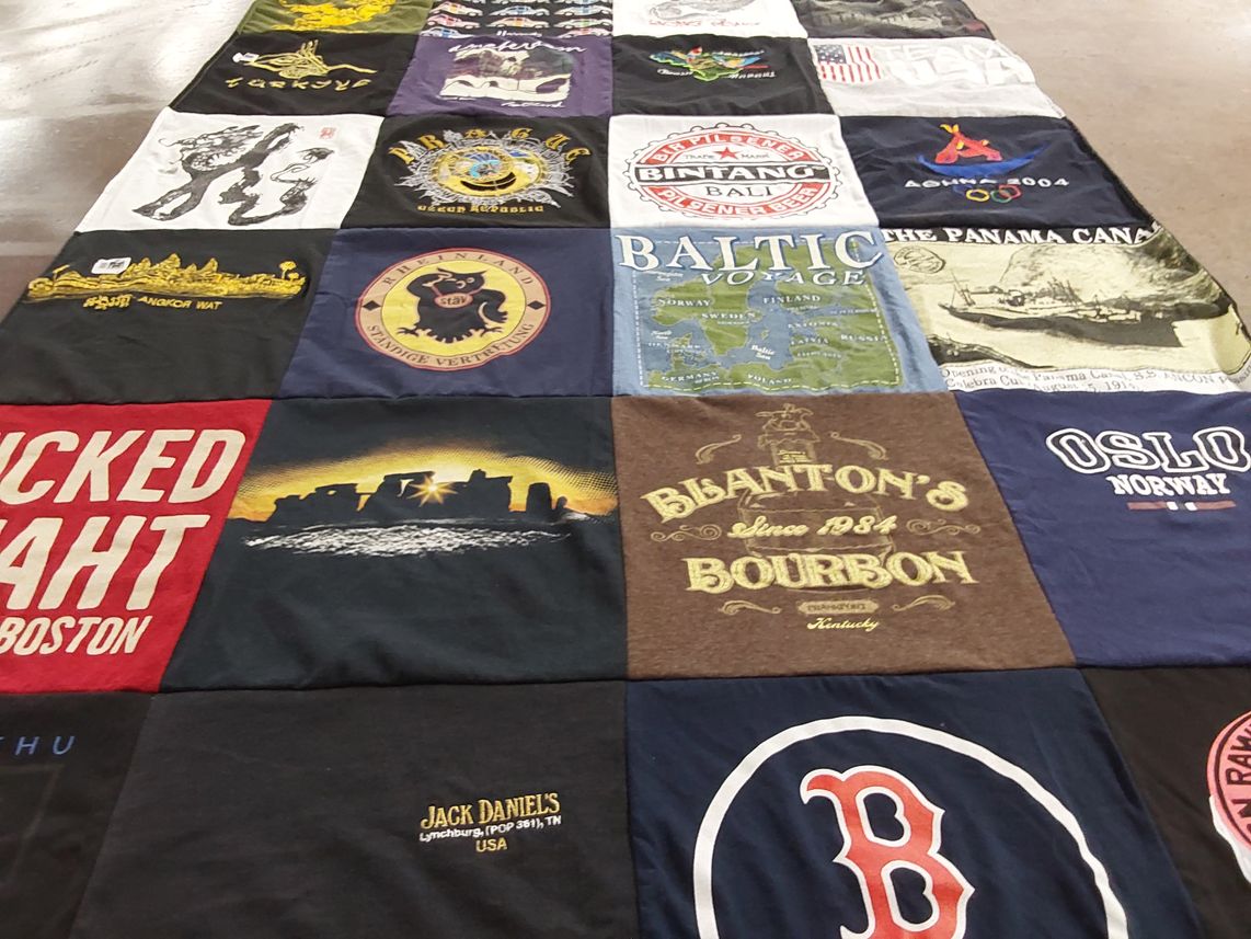 T-shirt quilt with travel, whiskey themes by Louis from FL