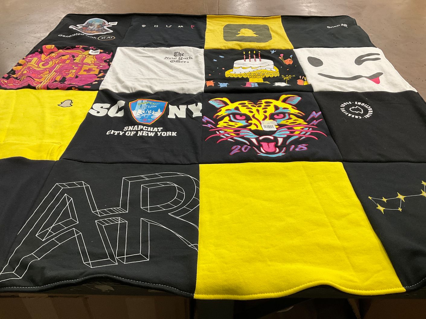 T-shirt quilt with technology, social media themes by Fernanda from NJ