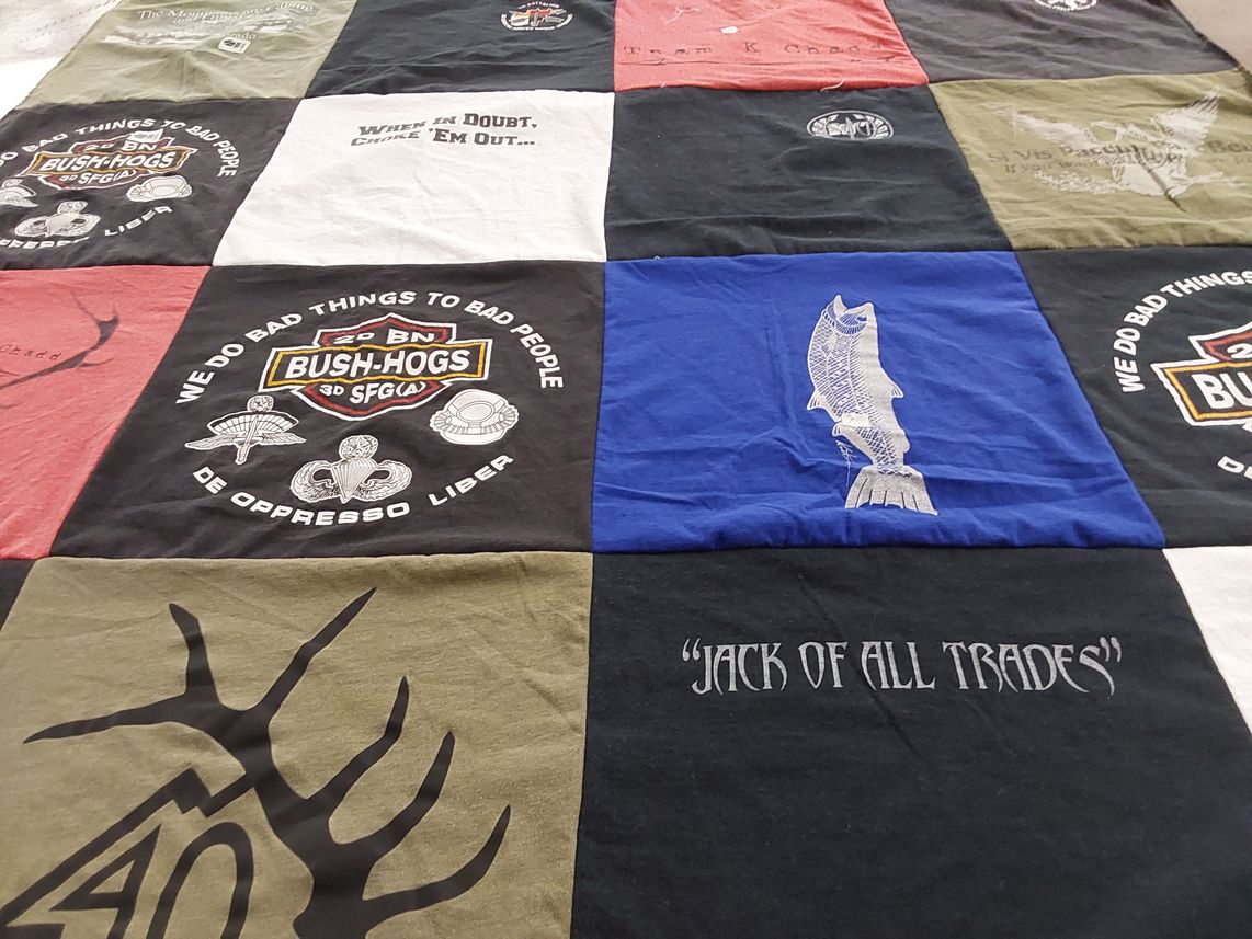 T-shirt quilt with hunting, fishing themes by MARK from CO