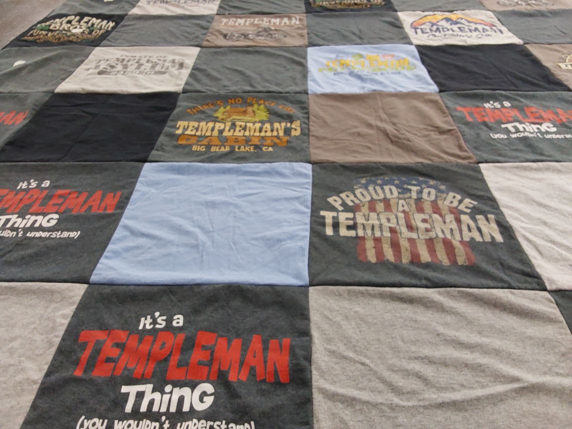 T-shirt quilt with family, community themes by Laura from CA