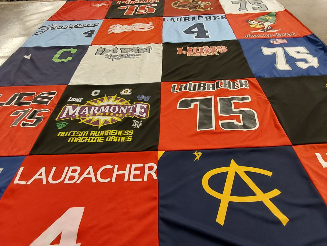 T-shirt quilt with sports, autism awareness themes by bree from CA