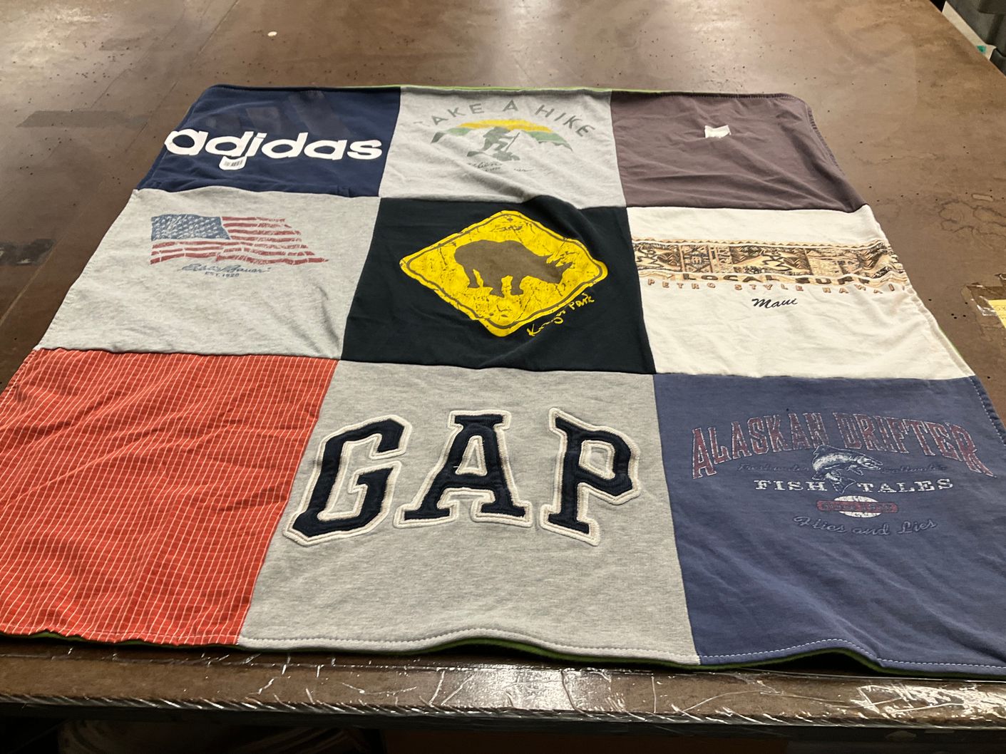 T-shirt quilt with hiking, fishing themes by Susan from NJ