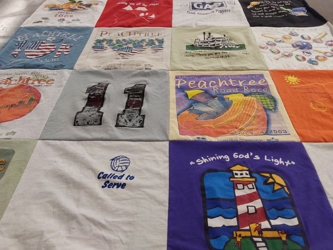 T-shirt quilt with running, volleyball themes by JULIE from GA