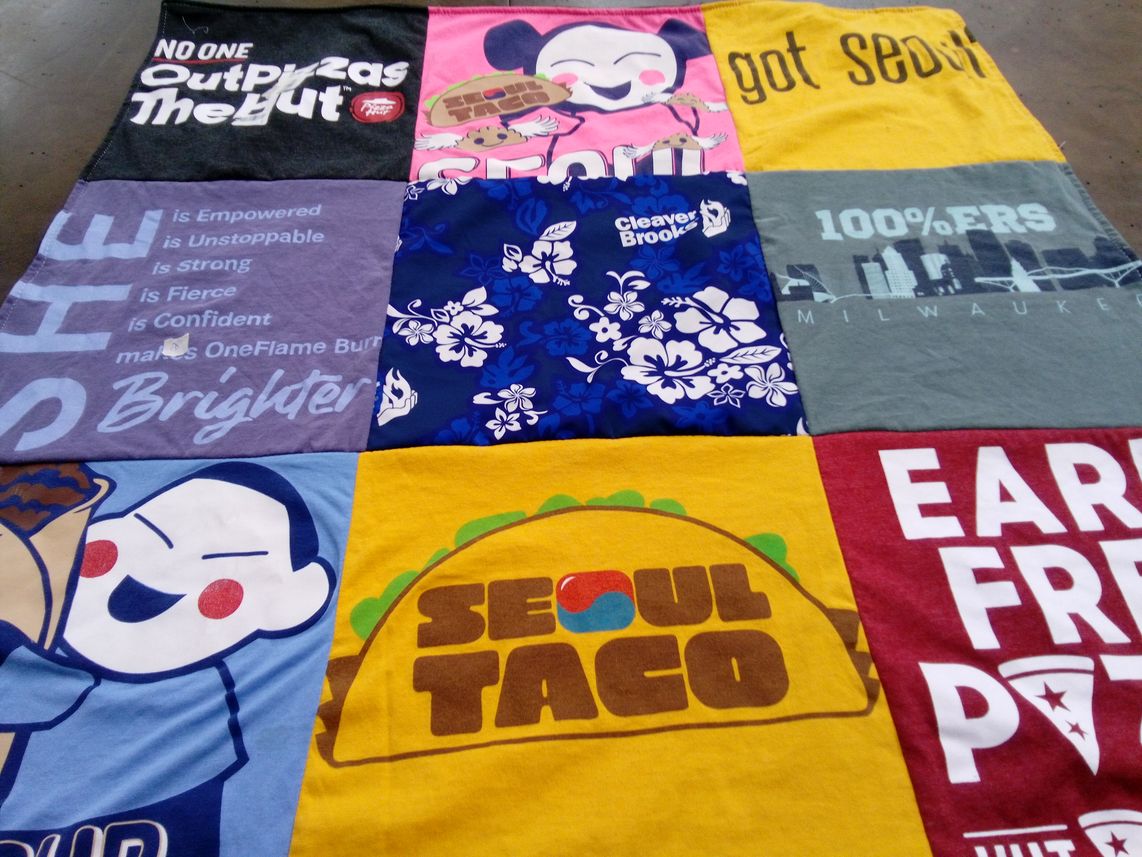 T-shirt quilt with food, empowerment themes by Deena from IL