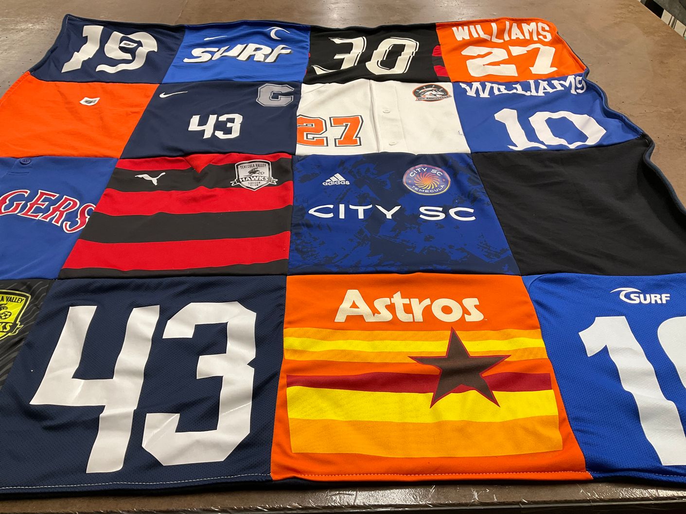 T-shirt quilt with sports, soccer themes by Amy-Mo'Nique from CA