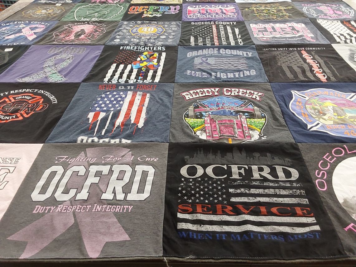 T-shirt quilt with firefighting, community service themes by Sarah from FL
