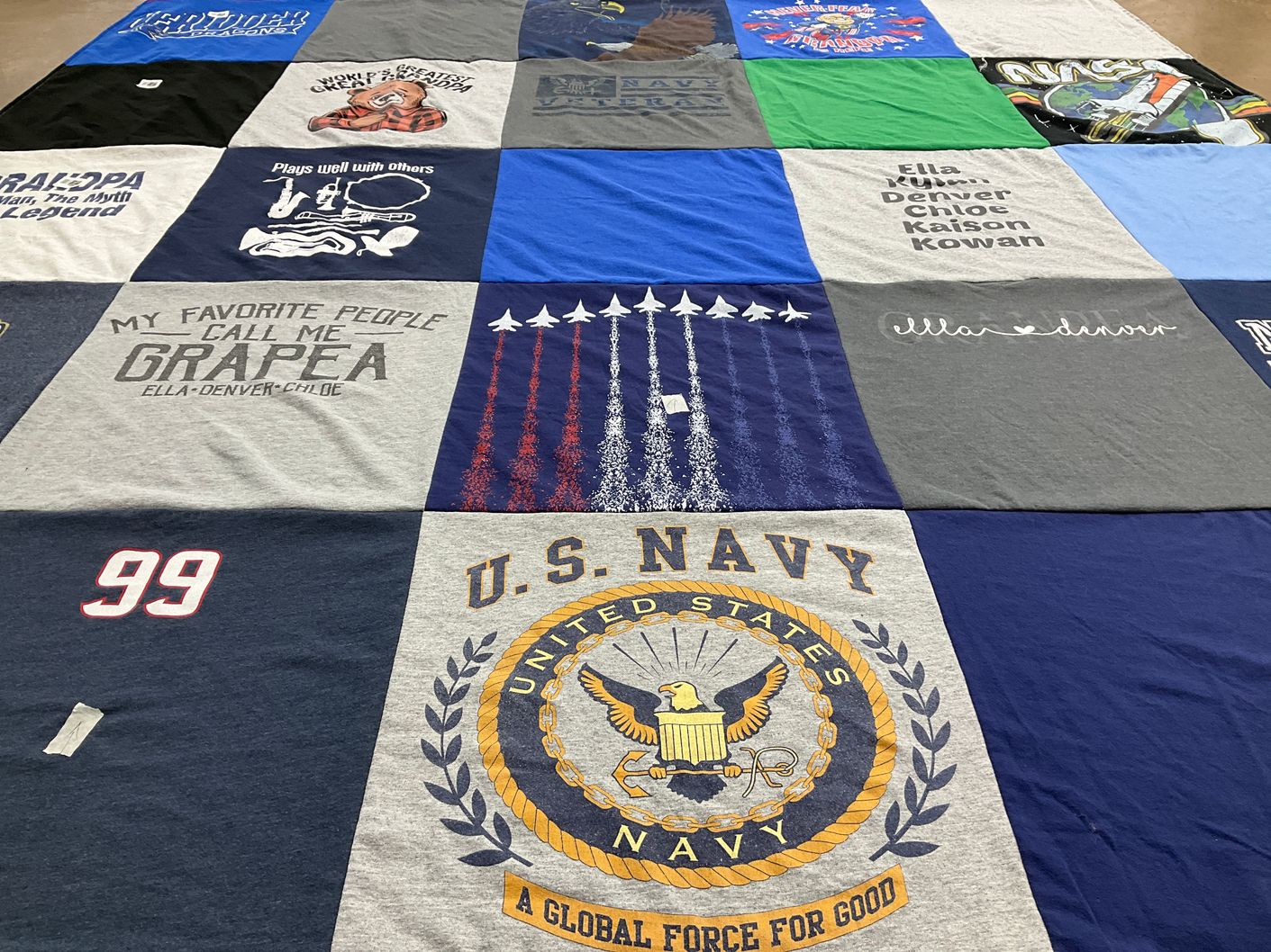 T-shirt quilt with family themes by Kari from MN