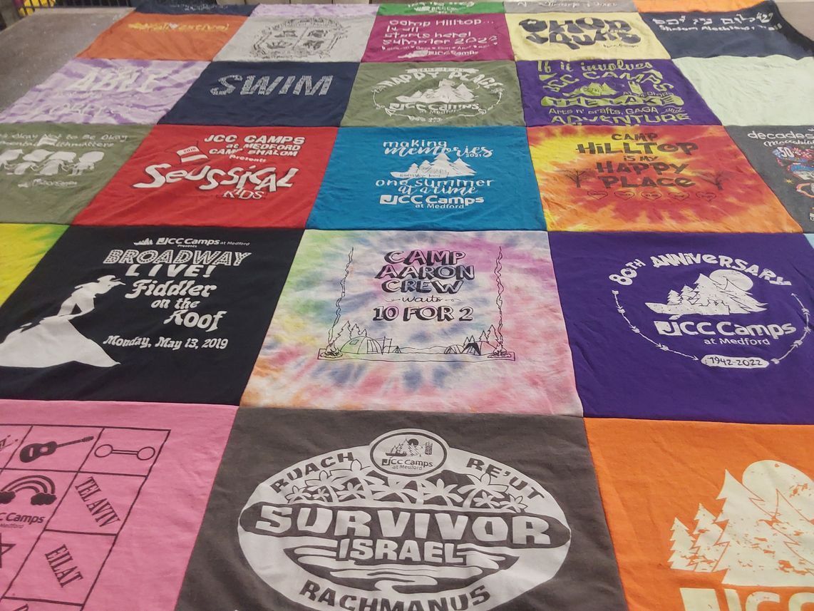 T-shirt quilt with camping, theater themes by Sara from NJ