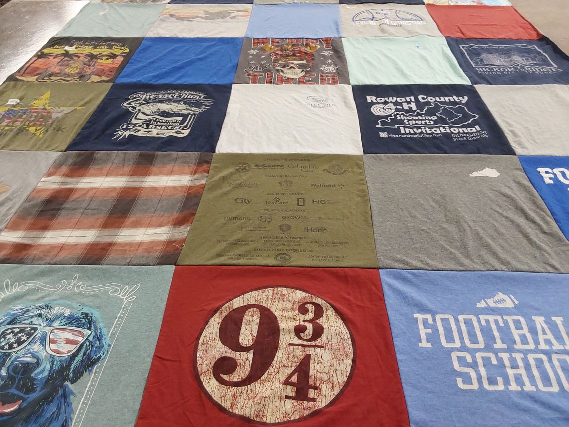 T-shirt quilt with sports, dogs themes by Malinda from CA