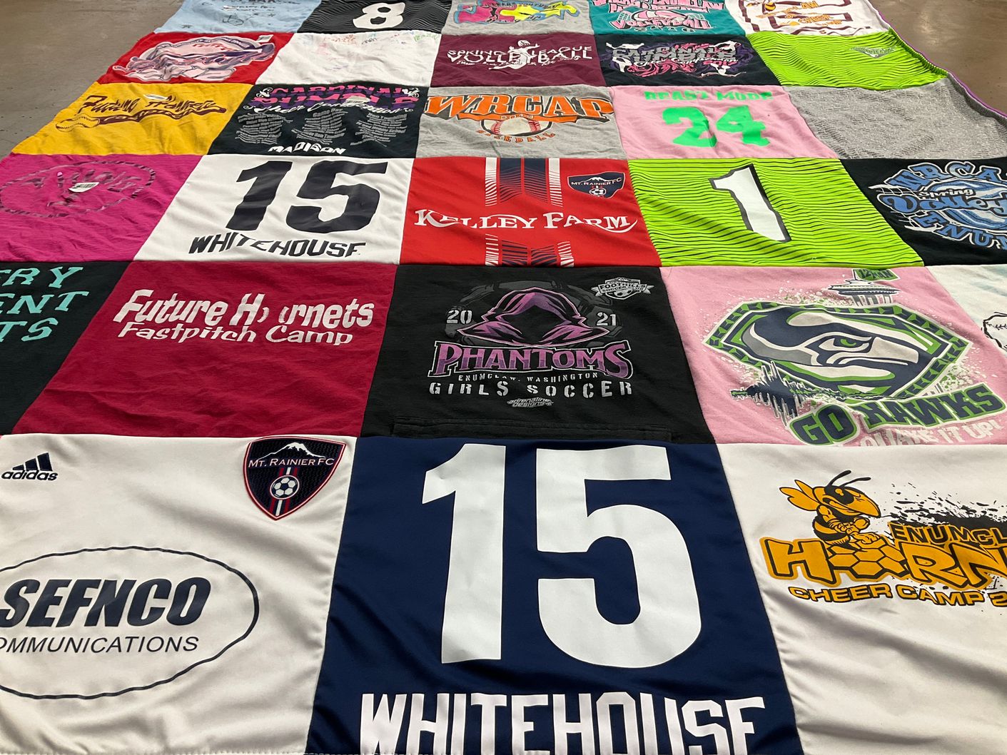 T-shirt quilt with soccer, cheerleading themes by Sue from WA