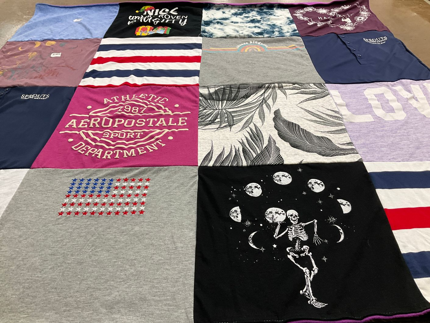 T-shirt quilt with sports, fashion themes by Judy from CA