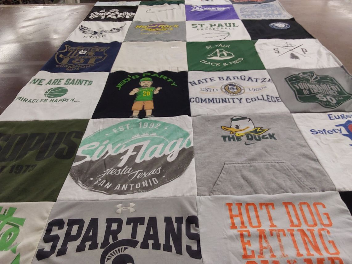T-shirt quilt featuring saint paul basketball, saint paul track & field by Carrie from OR
